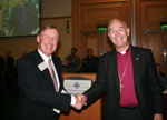 Mr Ian Noad accepts his award from the Archbishop of Armagh