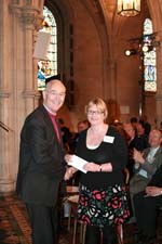 The Archbishop presents the Diocesan Magazine prize winner to Rev Pat Storey