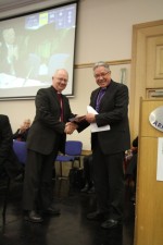 The Bishop of Limerick collects his prize in the General Synod Caption Competition